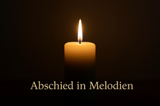 Brennende Kerze vor dunklem Hintergrund symbolisisch für Trauermusik