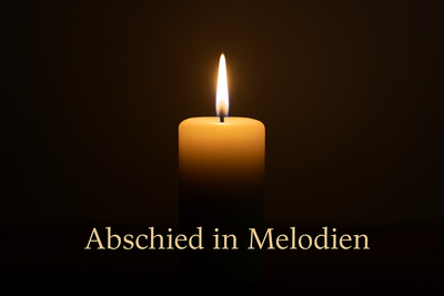Brennende Kerze vor dunklem Hintergrund symbolisisch für Trauermusik
